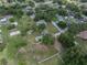 Overhead shot of the property highlighting the pool and large lot within a neighborhood setting with lots of green space at 929 Hammock Shade Dr, Lakeland, FL 33809