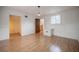 Well-lit bedroom with hardwood floors, fresh paint, and direct access to the hallway at 929 Hammock Shade Dr, Lakeland, FL 33809