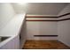 Storage room features wood floors, built-in shelving, and a utility sink at 929 Hammock Shade Dr, Lakeland, FL 33809