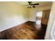 Comfortable bedroom with hardwood floors and ceiling fan, perfect for relaxation and restful nights at 938 E Lowell St, Lakeland, FL 33805