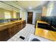 Updated kitchen showcasing butcher block counters, tile backsplash, and stainless steel refrigerator at 938 E Lowell St, Lakeland, FL 33805