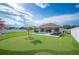 Expansive backyard offering a pool, putting green, and ample space for outdoor enjoyment at 967 Hunters Meadow Ln, Lakeland, FL 33809