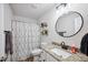 Well-designed bathroom featuring granite countertops and a shower/tub combination at 967 Hunters Meadow Ln, Lakeland, FL 33809