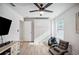 Bedroom featuring a large closet, ceiling fan, TV, and wood-look floors at 967 Hunters Meadow Ln, Lakeland, FL 33809