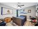 Bedroom featuring a ceiling fan, wood-look floors, and natural light at 967 Hunters Meadow Ln, Lakeland, FL 33809