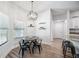 Cozy breakfast nook with modern light fixture and natural light streaming through the windows at 967 Hunters Meadow Ln, Lakeland, FL 33809