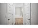 Hallway view of a soaking tub and stand-up shower room with tile flooring at 967 Hunters Meadow Ln, Lakeland, FL 33809