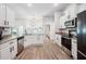 Well-appointed kitchen featuring granite countertops, white cabinetry, and stainless appliances at 967 Hunters Meadow Ln, Lakeland, FL 33809