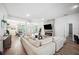 Open-concept living area showcasing natural light, fireplace, and dining area at 967 Hunters Meadow Ln, Lakeland, FL 33809