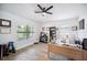 Bright home office with a ceiling fan, lots of light and wood flooring at 967 Hunters Meadow Ln, Lakeland, FL 33809
