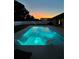 Beautiful pool with fountains, lights, and lounge chairs for relaxing in the evening and enjoying the sunset views at 967 Hunters Meadow Ln, Lakeland, FL 33809
