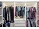 Spacious walk-in closet featuring custom shelving, lighting, and ample storage space at 967 Hunters Meadow Ln, Lakeland, FL 33809