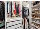 Walk-in closet with custom shelves, lighting, drawers and ample room for storage at 967 Hunters Meadow Ln, Lakeland, FL 33809