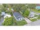 Aerial view of the home shows the roof, yard, driveway and neighborhood at 980 S Mill Ave, Bartow, FL 33830