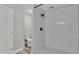 New bathroom features a white tiled shower, modern fixtures, and updated design at 980 S Mill Ave, Bartow, FL 33830