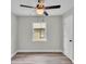 Bedroom with neutral walls, modern ceiling fan, and newly installed flooring at 980 S Mill Ave, Bartow, FL 33830
