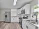 Beautiful kitchen with white cabinets, stainless steel appliances, and modern countertops at 980 S Mill Ave, Bartow, FL 33830