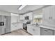 Beautiful kitchen with white cabinets, stainless steel appliances, and modern countertops at 980 S Mill Ave, Bartow, FL 33830