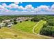 Drone view of the property featuring expansive land, neighborhood houses, and picturesque scenery at 10 Webb Rd, Winter Haven, FL 33881