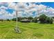 Expansive backyard featuring a versatile metal building, perfect for hobbies or storage on the property at 10 Webb Rd, Winter Haven, FL 33881