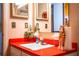 Close up of the bathroom vanity showcasing a retro red countertop, decorative mirrors, and vintage bathroom accessories at 10 Webb Rd, Winter Haven, FL 33881