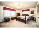Comfortable bedroom featuring a wooden bed frame and ceiling fan, creating a relaxing atmosphere at 10 Webb Rd, Winter Haven, FL 33881