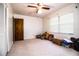 Bright bedroom with a ceiling fan, window, and closet creates a comfortable and functional space at 10 Webb Rd, Winter Haven, FL 33881