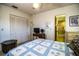Bedroom featuring a closet with louvered doors and a view into an adjacent bathroom with a shower at 10 Webb Rd, Winter Haven, FL 33881