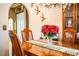 Charming dining room with hardwood table, chandelier, decorative walls, and open to other spaces at 10 Webb Rd, Winter Haven, FL 33881
