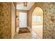 Welcoming entryway with tile flooring, coat closet and unique wall decor leads to the living spaces at 10 Webb Rd, Winter Haven, FL 33881