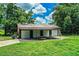 Rustic barn with covered parking, perfect for storing equipment and enjoying outdoor projects at 10 Webb Rd, Winter Haven, FL 33881