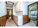 Hallway leading to a bedroom with storage cabinets at 10 Webb Rd, Winter Haven, FL 33881