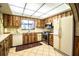 Cozy kitchen featuring light countertops, stainless steel appliances, and wood-look cabinets at 10 Webb Rd, Winter Haven, FL 33881