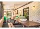 Relaxing screened-in porch features a ceiling fan and outdoor seating, perfect for enjoying the fresh air at 10 Webb Rd, Winter Haven, FL 33881