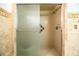 Updated bathroom showing neutral tile shower with sliding glass doors at 10 Webb Rd, Winter Haven, FL 33881