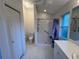 Bathroom featuring a walk-in shower, toilet, closet, and vanity at 1011 Tequesta Trl, Lake Wales, FL 33898