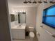 Standard bathroom features a single sink vanity and a window with blinds at 1011 Tequesta Trl, Lake Wales, FL 33898