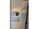 Bathroom with a large mirror, vanity, and a white tile floor at 1011 Tequesta Trl, Lake Wales, FL 33898