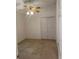 Standard bedroom with a ceiling fan and closet doors at 1011 Tequesta Trl, Lake Wales, FL 33898