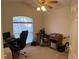 Bedroom features a large window offering great natural light and space for an office setup at 1011 Tequesta Trl, Lake Wales, FL 33898