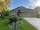 Charming single-Gathering home with beautiful landscaping and well-maintained lawn at 1011 Tequesta Trl, Lake Wales, FL 33898