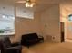 Bright living space with a ceiling fan, offering versatility and comfort with easy kitchen access at 1011 Tequesta Trl, Lake Wales, FL 33898