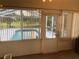Enclosed patio with a view of the pool and backyard at 1011 Tequesta Trl, Lake Wales, FL 33898