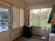 Enclosed patio with a view of a manicured lawn at 1011 Tequesta Trl, Lake Wales, FL 33898
