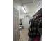 Walk-in closet with overhead lighting, built-in shelves, and lots of storage space at 1011 Tequesta Trl, Lake Wales, FL 33898