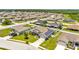 Aerial view of a neighborhood with lush green lawns and well-maintained homes at 1028 15Th Ne St, Winter Haven, FL 33881
