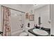 Cozy bathroom with tub-shower combination and decorative accents at 1028 15Th Ne St, Winter Haven, FL 33881