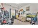 Eclectic bedroom with quirky decor, musical instruments, and a comfortable sitting area at 1028 15Th Ne St, Winter Haven, FL 33881