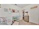 Bedroom with crib, changing table, chair, and closet at 1028 15Th Ne St, Winter Haven, FL 33881