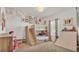 Charming bedroom featuring a custom-built bunk bed with stairs and whimsical decor at 1028 15Th Ne St, Winter Haven, FL 33881